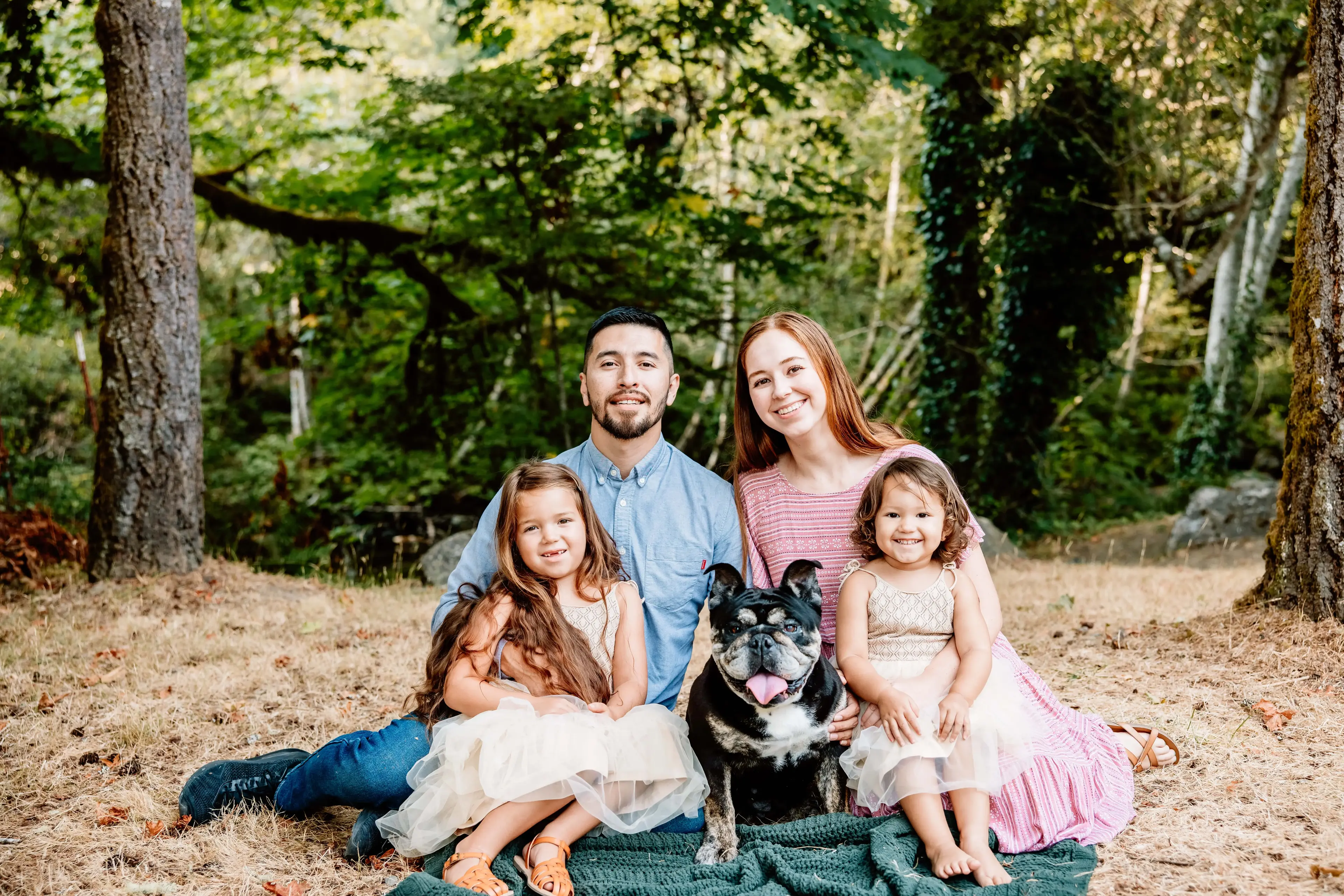 Freddy with his family posing for a picture.